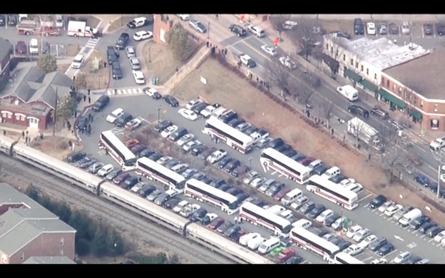 Buses alongside train in Charlottesville to pick up members of Congress and take them to WV for their retreat, which will proceed with an adjusted program.   
