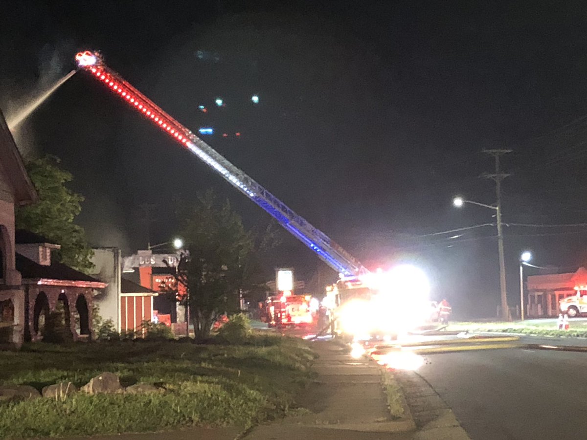 Fire crews are battling an aggressive fire on West Main Street in Danville.