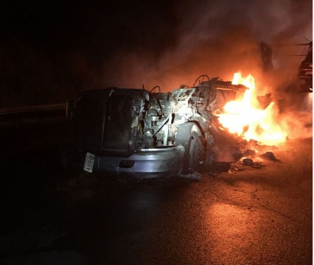Single left lane gets by scene of early morning tractor trailer fire on WB I-66 at the 18 mile marker in Fauquier Co. Tow on scene working on plan to removed burned wreckage. No injuries
