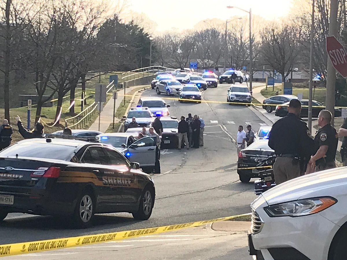 The scene outside the Fairfax County Courthouse where a man was shot in the parking garage, taken to the  hospital in critical condition. Police have swarmed the area looking for the suspect. The courthouse & its campus are locked down