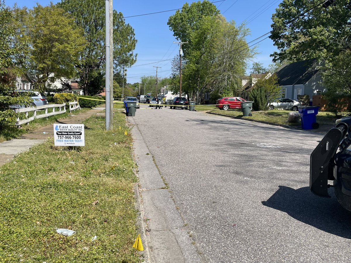 Here's what the scene at Shelton Ave looks.   Several police markers fill up part of the street.  Officers are taking pictures of the scene