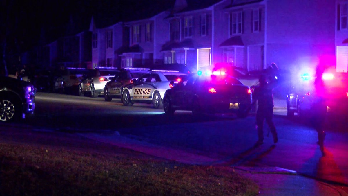 Police cars and forensic teams lined Timsberry Circle to investigate an officer-involved shooting that took place in this neighborhood. 