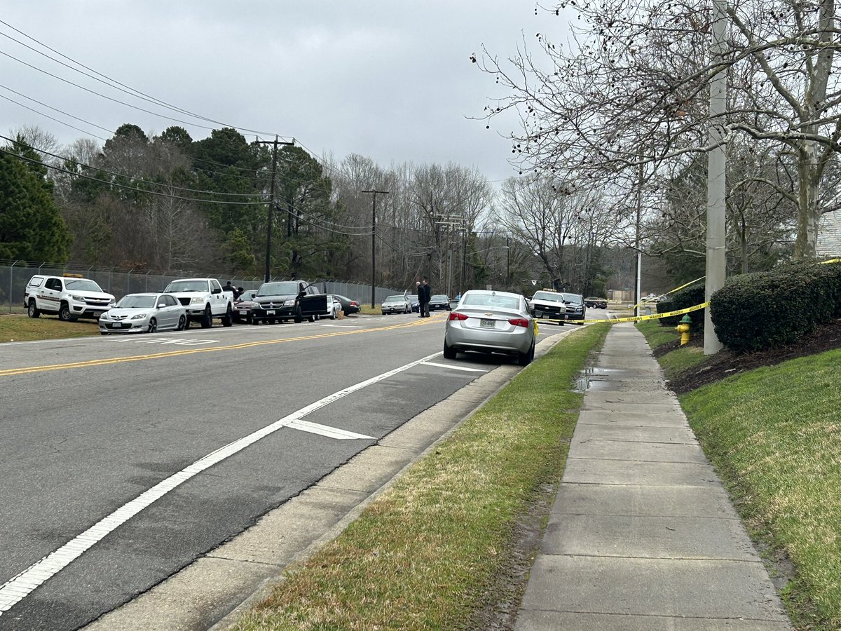 Virginia Beach Police are investigating a suspicious death on Harpers Road, across from Ocean Gate Apartments. Police officers seem to be focused on a red car parked on the road